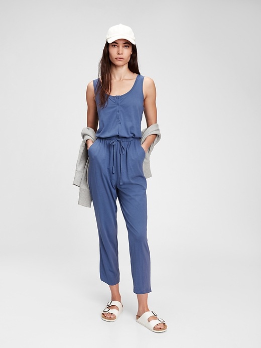 1 of 8 showing, with the color chrome blue of product Sleeveless Henley Jumpsuit