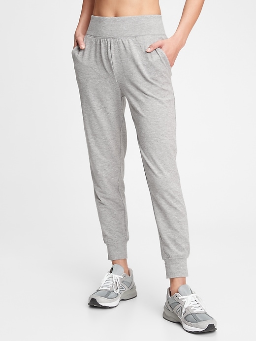 View large product image 1 of 1. GapFit High Rise Brushed Tech Jersey Joggers