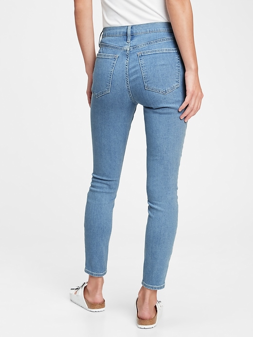 2 of 8 showing, with the color light indigo of product Mid Rise True Skinny Jeans