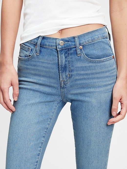 Image number 5 showing, Mid Rise True Skinny Jeans With Washwell&#153