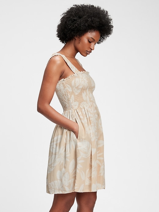 1 of 8 showing, with the color beige palm print of product Smocked Mini Dress