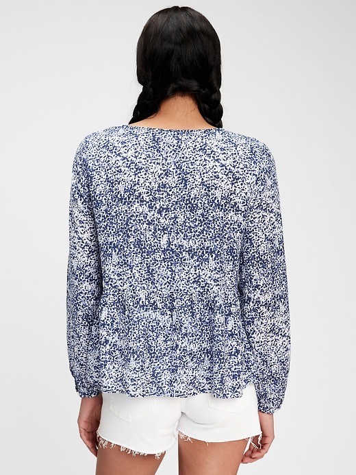 2 of 8 showing, with the color navy blue print of product V-Neck Peplum Top