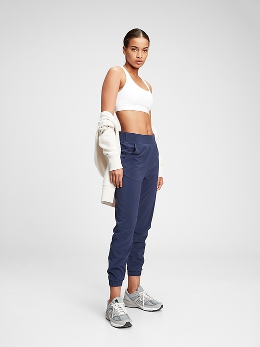 1 of 8 showing, with the color elysian blue of product GapFit Runaround Everstretch Joggers