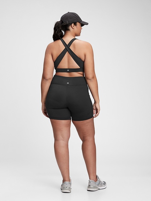 2 of 8 showing, with the color true black of product GapFit Blackout Medium Impact Crossback Sports Bra