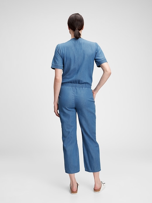 2 of 8 showing, with the color medium wash of product Maternity V-Neck Jumpsuit