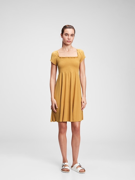 1 of 8 showing, with the color golden yellow of product Smocked Mini Dress