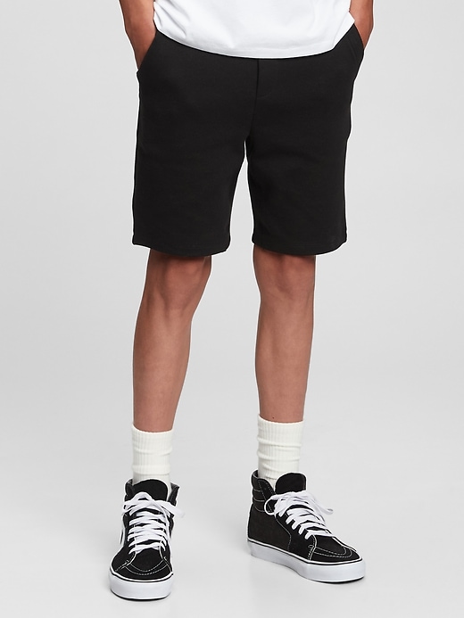1 of 8 showing, with the color true black of product GapFit Teen Fit Tech Shorts