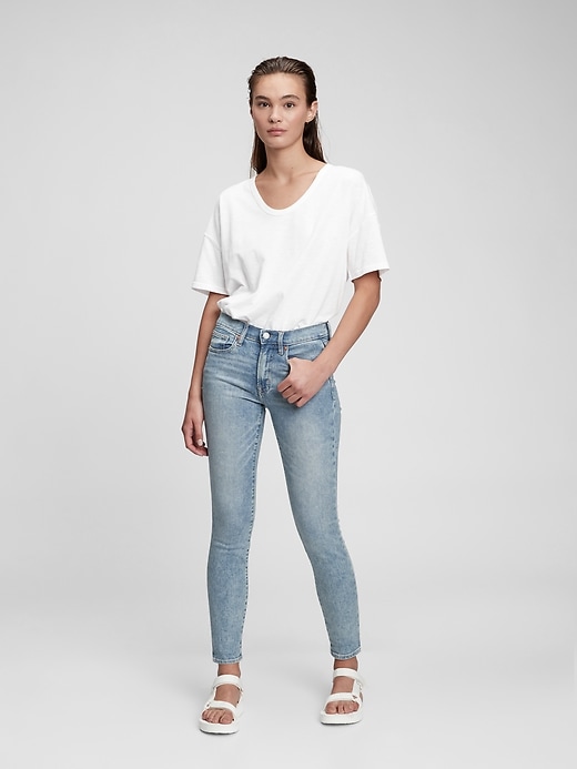 1 of 8 showing, with the color light indigo of product Mid Rise True Skinny Jeans with Washwell