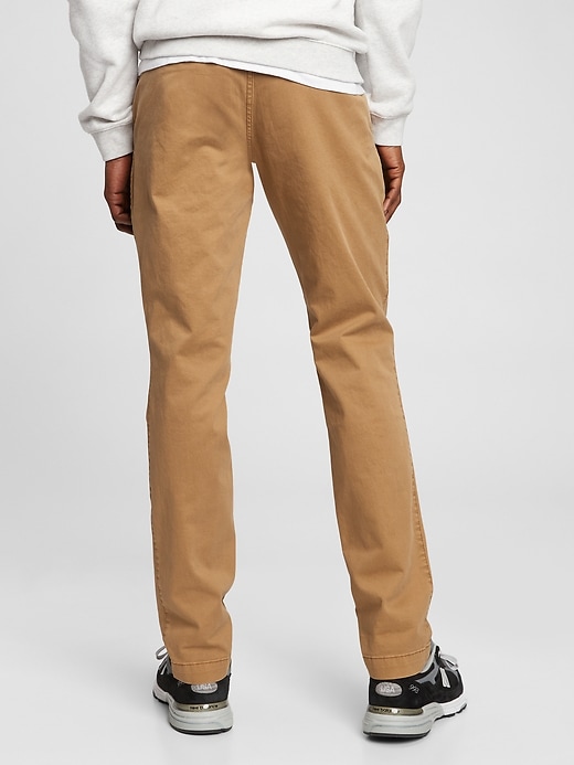 2 of 8 showing, with the color palomino brown of product Vintage Khakis in Skinny Fit with GapFlex