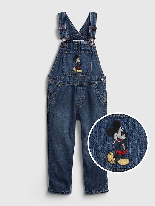 1 of 8 showing, with the color dark wash of product Gap × Disney Baby & ToddlerMickey Mouse Denim Overalls