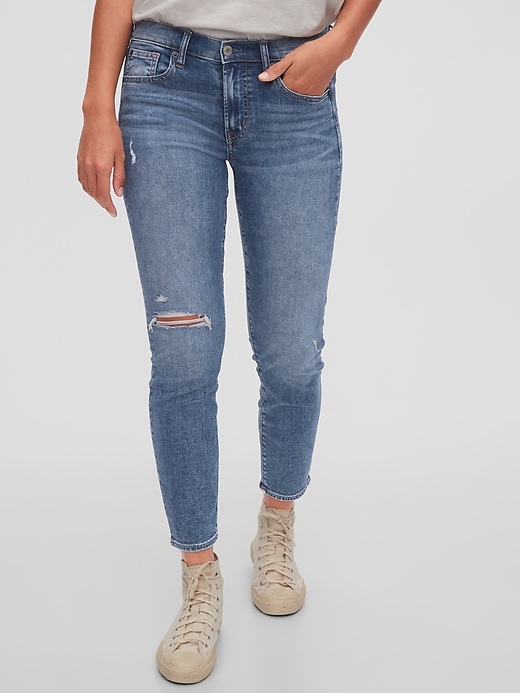 1 of 8 showing, with the color light indigo destroy of product Mid Rise True Skinny Jeans with Washwell
