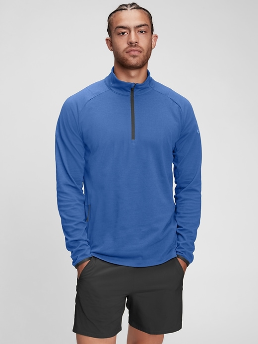 1 of 8 showing, with the color sailor blue of product GapFit Mockneck Half-Zip Train Sweatshirt