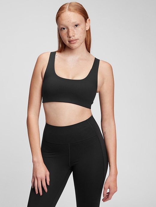 1 of 8 showing, with the color true black of product GapFit Low Impact Power Scoopneck Sports Bra