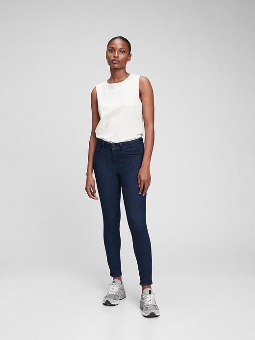 1 of 8 showing, with the color dark indigo of product Mid Rise Universal Jegging with Washwell