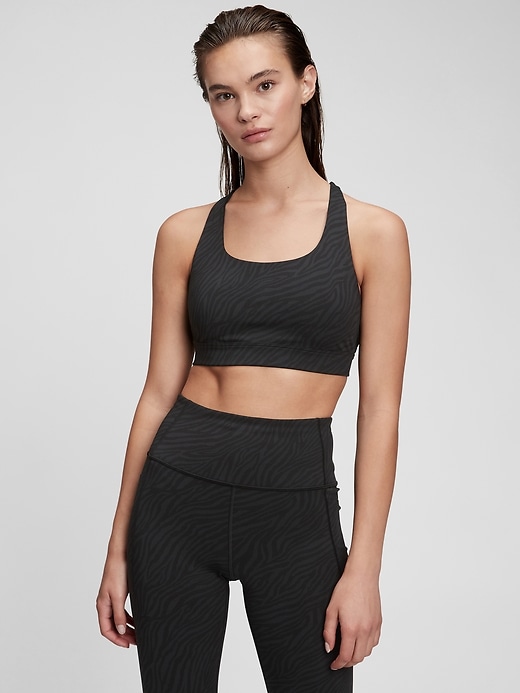 1 of 8 showing, with the color black zebra print of product GapFit Recycled Power Crossback Sports Bra
