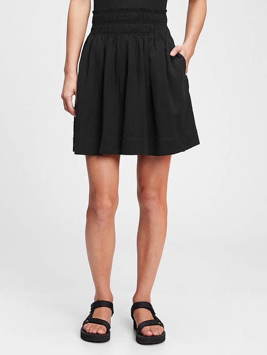 1 of 8 showing, with the color true black of product Smocked Mini Skirt