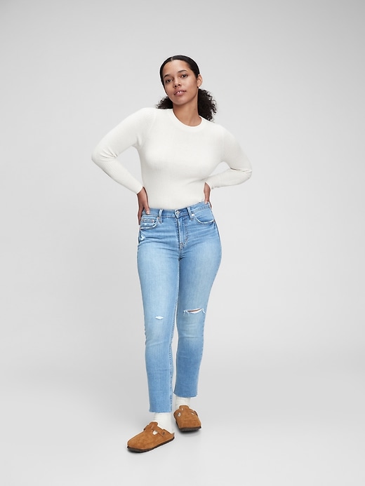1 of 8 showing, with the color light indigo of product Mid Rise Vintage Slim Jeans with Washwell
