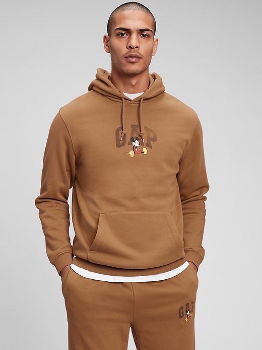 2 of 8 showing, with the color maple sugar beige of product Adult Gap x Disney Logo Hoodie
