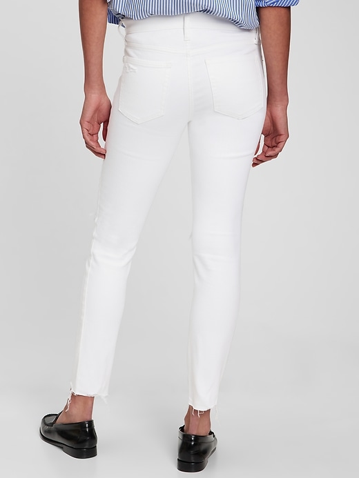 2 of 8 showing, with the color white destroy of product Mid Rise True Skinny Jeans with Washwell