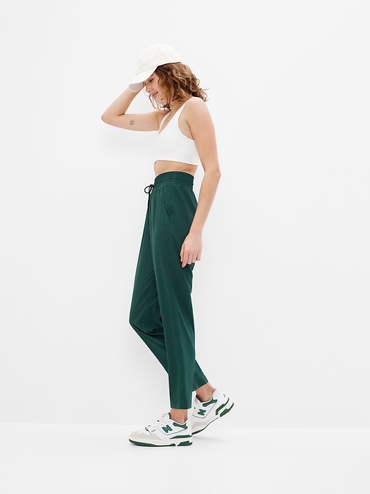 1 of 8 showing, with the color hunter green of product GapFit High Rise Runaround Pants
