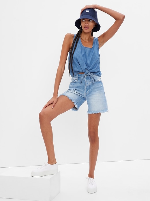 1 of 8 showing, with the color medium indigo of product Denim Cropped Knot Tank Top with Washwell