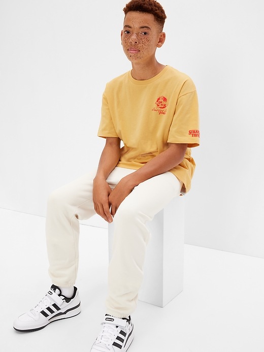 2 of 8 showing, with the color french almond of product Gap × Stranger Things Teen Graphic T-Shirt
