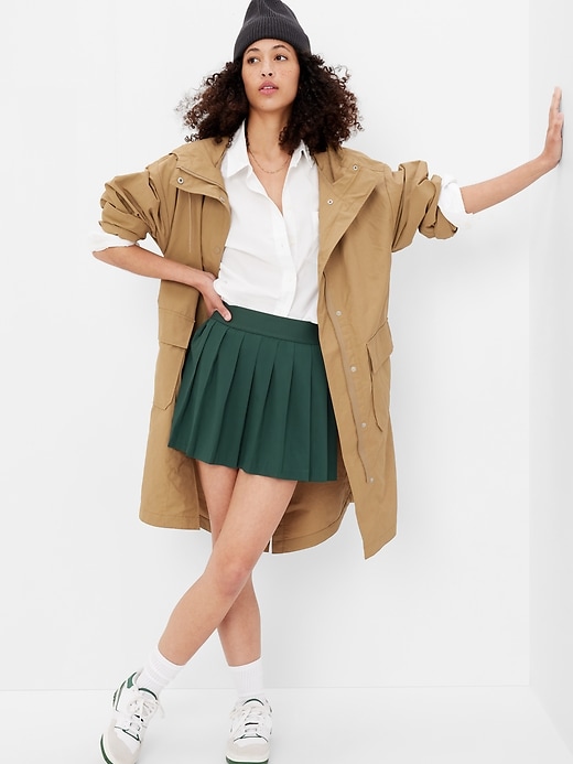 1 of 8 showing, with the color hunter green of product GapFit Recycled High Rise Pleated Tennis Skort