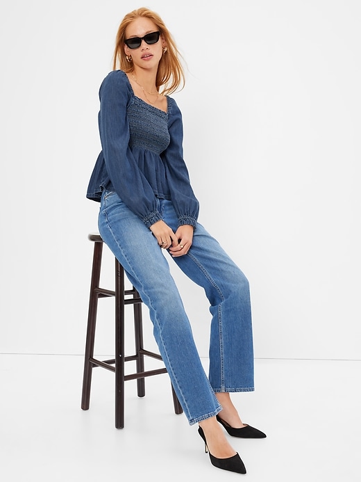 1 of 8 showing, with the color medium wash of product Denim Smocked Peplum Top with Washwell