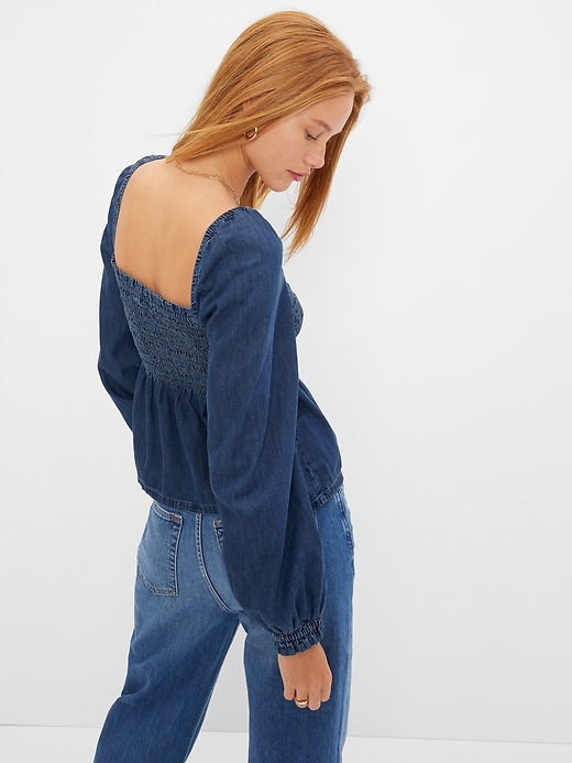 2 of 8 showing, with the color medium wash of product Denim Smocked Peplum Top with Washwell
