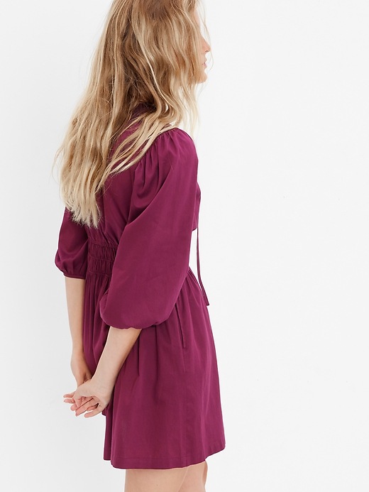 2 of 8 showing, with the color plum pudding purple of product Smocked Waist Puff Mini Dress