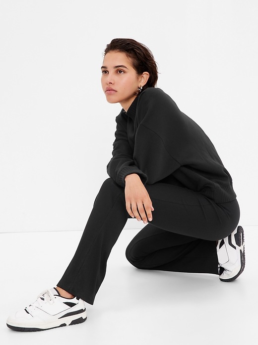 1 of 8 showing, with the color true black of product Mid Rise Rib Flare Pants