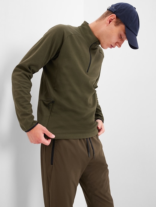 1 of 8 showing, with the color safari olive of product GapFit Mockneck Half-Zip Train Sweatshirt