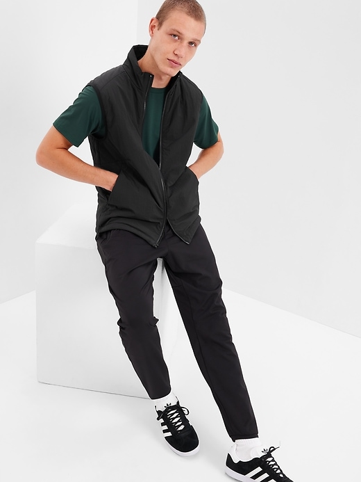1 of 8 showing, with the color true black of product GapFit Primaloft Vest