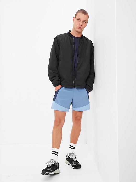 1 of 8 showing, with the color true black of product GapFit Primaloft Bomber Jacket