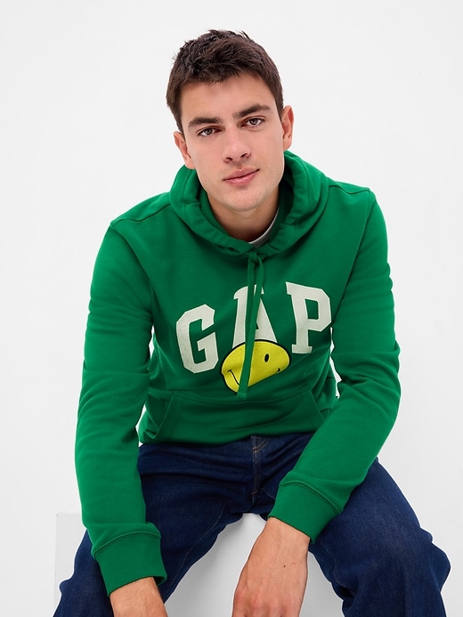 1 of 8 showing, with the color holiday green of product Gap × Smiley® Vintage Soft Logo Hoodie