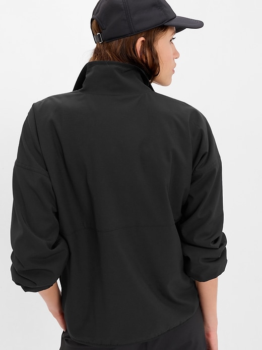 View large product image 2 of 4. GapFit Fleece-Lined Half-Zip Track Jacket