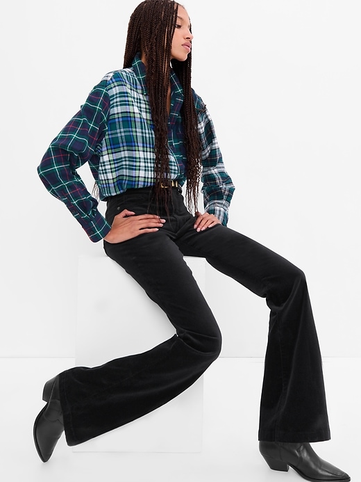 1 of 8 showing, with the color absolute black of product High Rise Velvet '70s Flare Jeans with Washwell