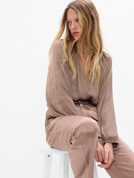 1 of 8 showing, with the color NEW CASHMERE of product Satin Wrap Bodysuit