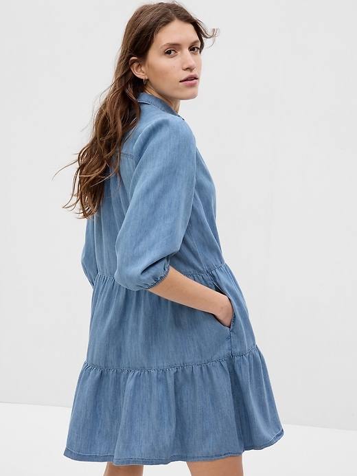 2 of 8 showing, with the color medium wash of product Puff Sleeve Denim Mini Shirtdress