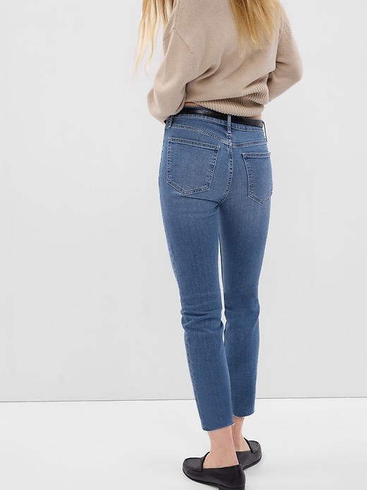 2 of 8 showing, with the color medium indigo of product Mid Rise Vintage Slim Jeans