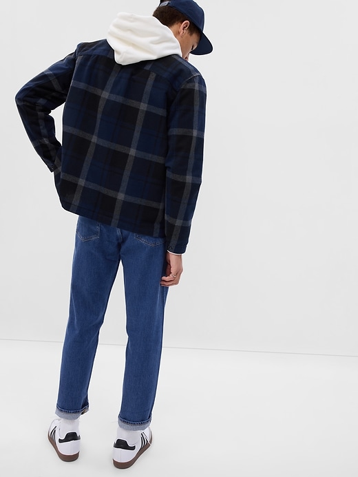 2 of 8 showing, with the color medium wash of product Relaxed Taper Jeans in GapFlex