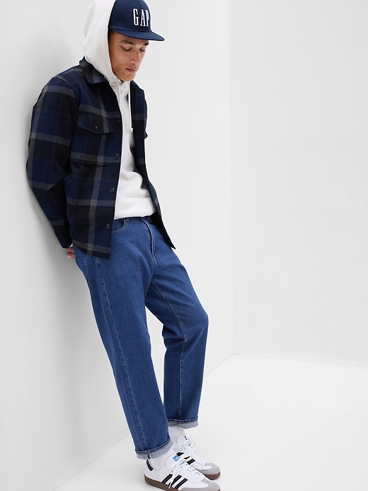 1 of 8 showing, with the color medium wash of product Relaxed Taper Jeans in GapFlex
