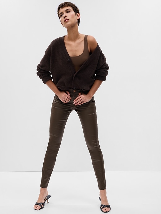 1 of 8 showing, with the color brown noir of product Mid Rise Coated Denim True Skinny Jeans