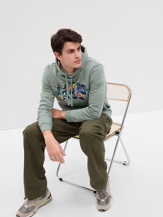 1 of 8 showing, with the color sage green of product Floral Gap Arch Logo Hoodie