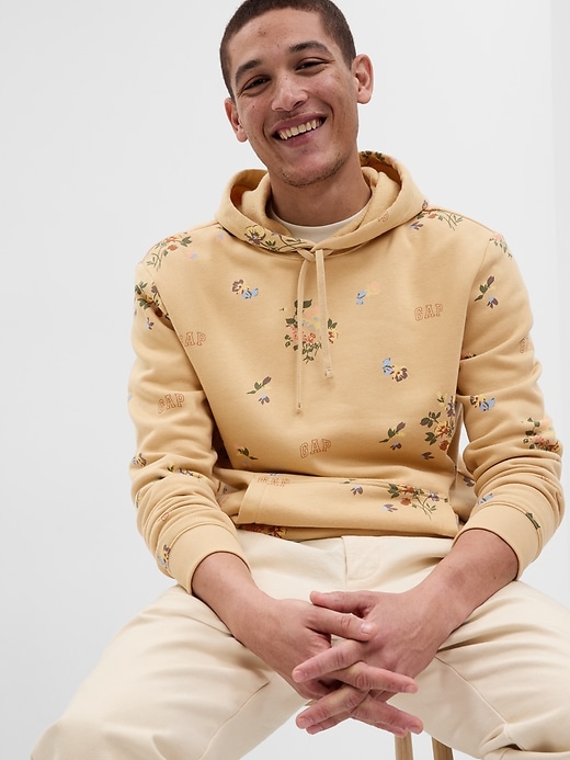 1 of 8 showing, with the color cashew crunch of product Allover Floral Gap Logo Hoodie