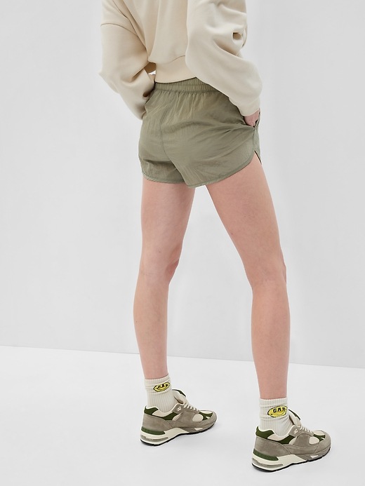 2 of 8 showing, with the color green chino beige of product GapFit High Rise Running Shorts