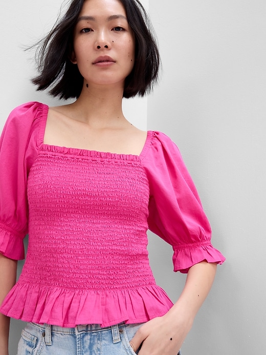 1 of 8 showing, with the color viva magenta pink of product Puff Sleeve Smocked Peplum Top