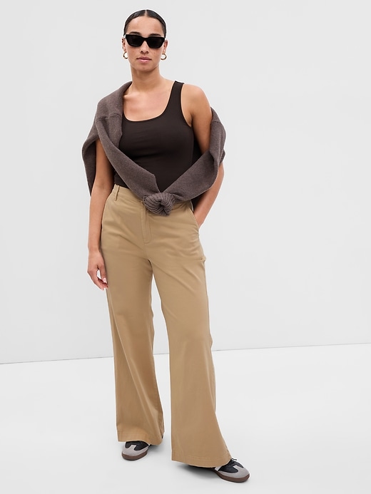 1 of 8 showing, with the color cashew crunch tan of product High Rise Flare Khakis