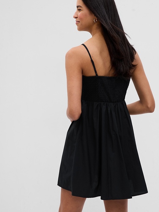 2 of 8 showing, with the color black of product Eyelet Empire Waist Mini Dress
