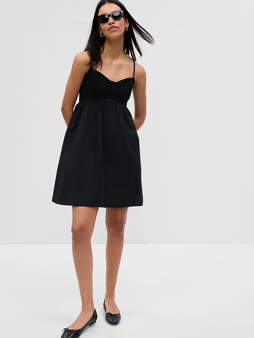 1 of 8 showing, with the color black of product Eyelet Empire Waist Mini Dress